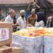 Pelaksana Tugas Direktur Utama Jasa Raharja, Dewi Aryani Suzana saat memberikan bantuan pasca bencana banjir di Pidie. (Dok: Rahmat)