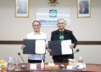 BPJS Kesehatan dan PT GoTo Gojek Tokopedia Tbk menandatangani Perjanjian Kerja Sama penguatan Program JKN guna memastikan perlindungan jaminan kesehatan berkelanjutan bagi pengemudi mitra Gojek, Senin (12/1/2026). (Dok: BPJS Kesehatan)